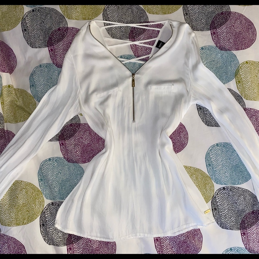 Blouse with front zipper and cross cross detail on back